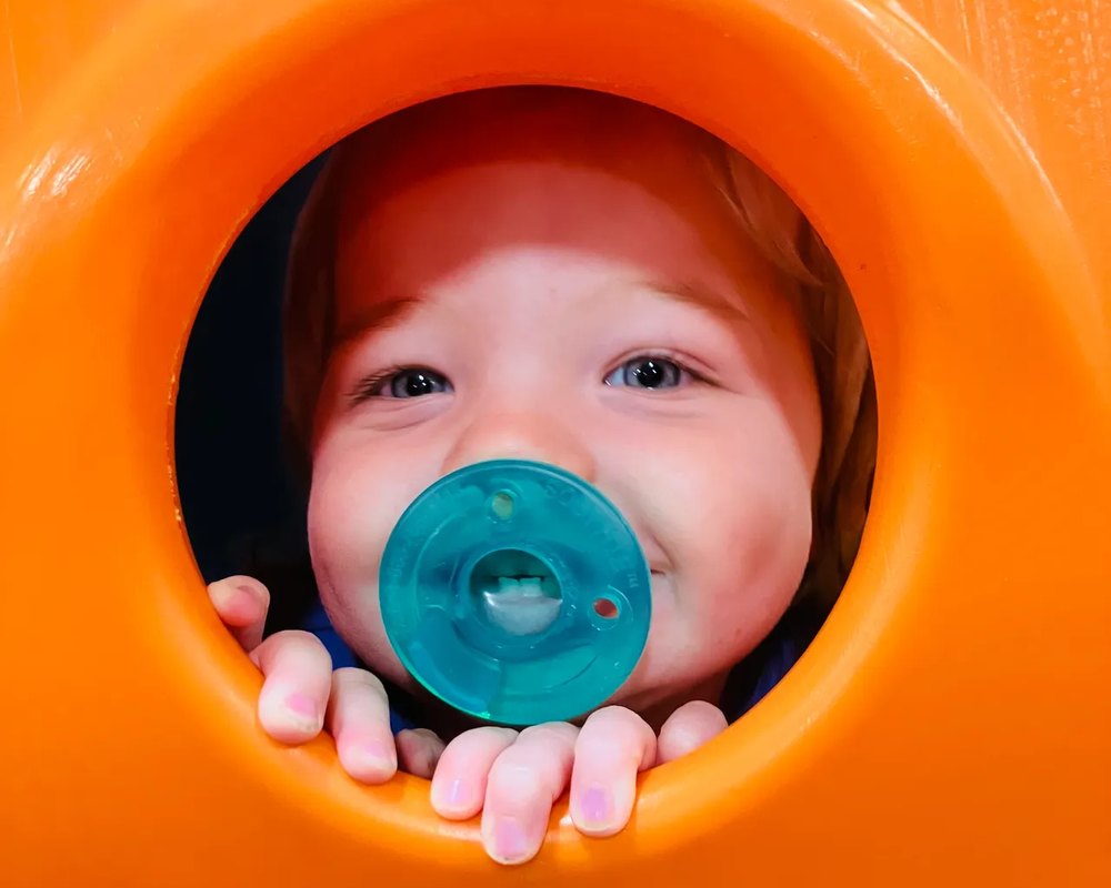 Peeking through the play tunnel